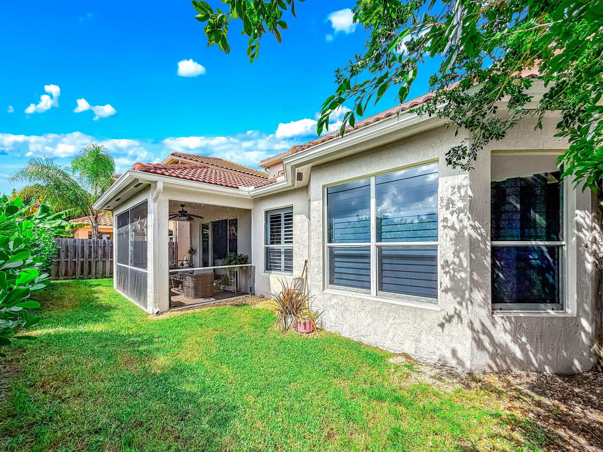 9760 Vineyard Court Boca Raton, FL 33428 - Photo 54 of 75 a front view of a house with a yard