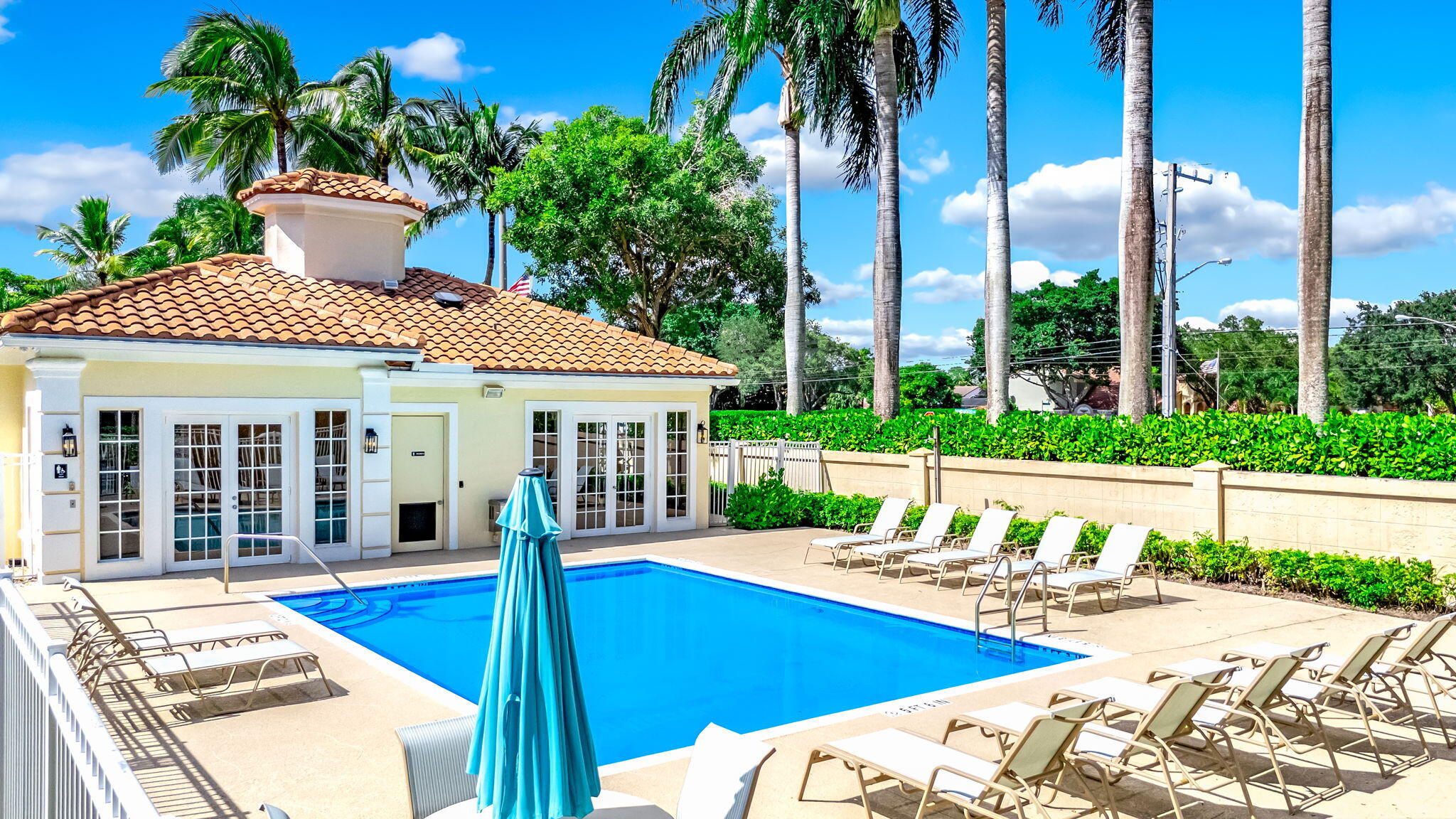 9760 Vineyard Court Boca Raton, FL 33428 - Photo 58 of 75 a view of a house with swimming pool and porch with furniture
