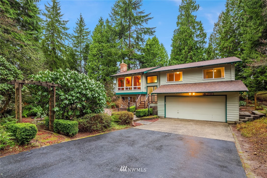 22918 38th Avenue Southeast Bothell, WA 98021 - Photo 1 of 28 a view of a house with a backyard