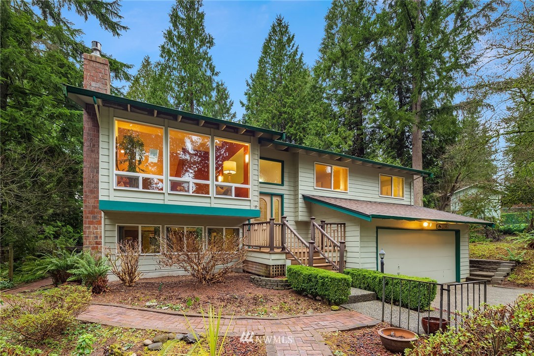 22918 38th Avenue Southeast Bothell, WA 98021 - Photo 2 of 28 a front view of a house with garden