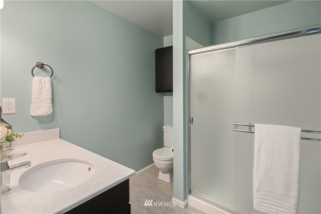 22918 38th Avenue Southeast Bothell, WA 98021 - Photo 14 of 28 a bathroom with a sink toilet and shower