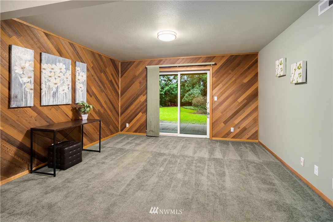 22918 38th Avenue Southeast Bothell, WA 98021 - Photo 18 of 28 a view of an empty room with a window and a livingroom