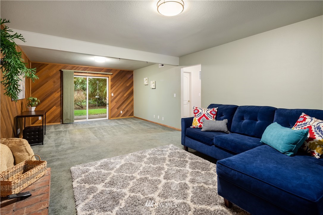 22918 38th Avenue Southeast Bothell, WA 98021 - Photo 19 of 28 a living room with furniture and a couch