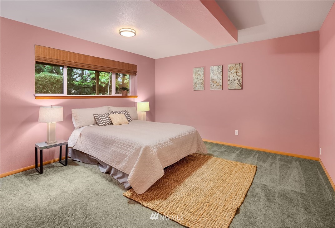 22918 38th Avenue Southeast Bothell, WA 98021 - Photo 22 of 28 a bedroom with a bed and a large window
