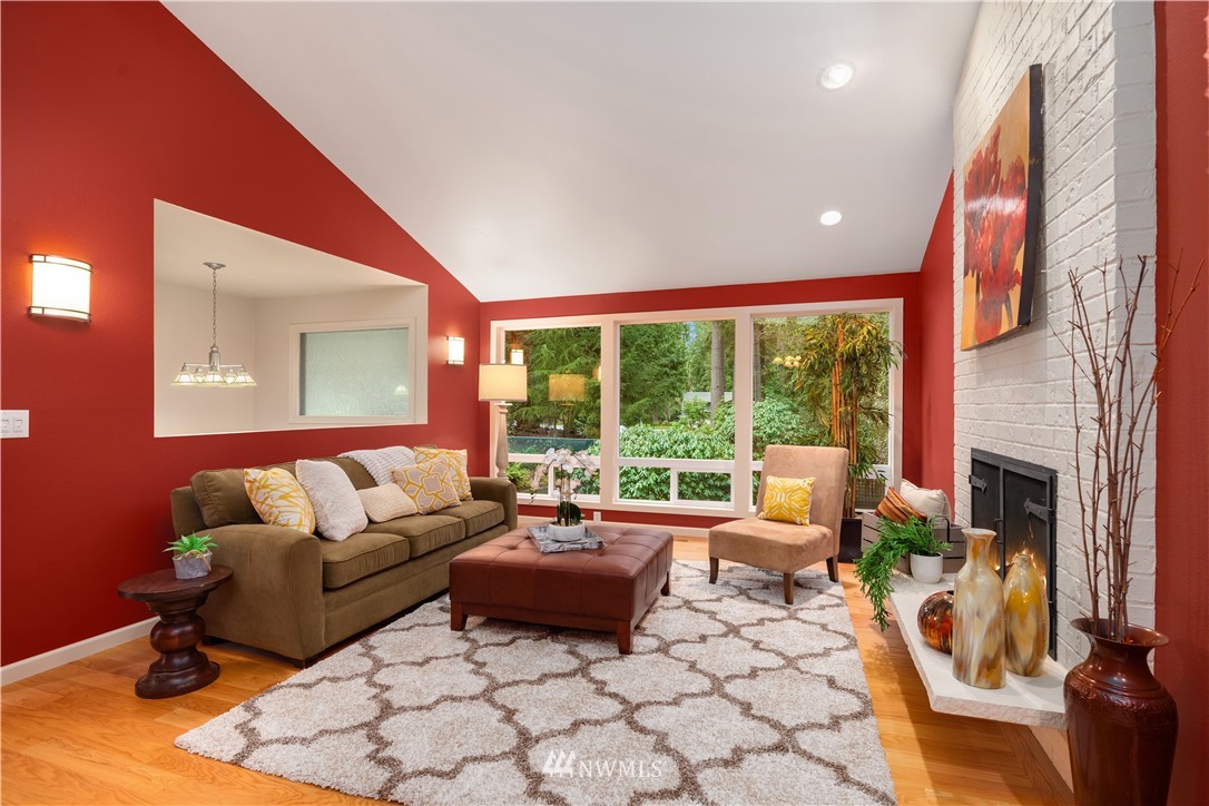 22918 38th Avenue Southeast Bothell, WA 98021 - Photo 4 of 28 a living room with furniture and a floor to ceiling window