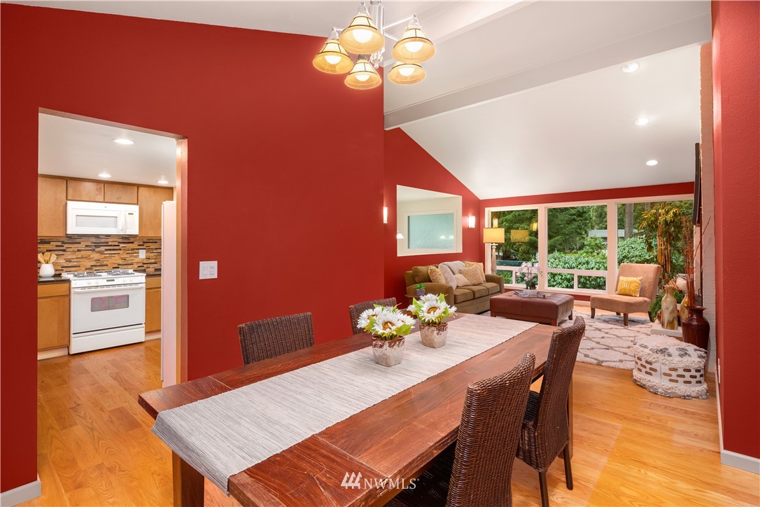 22918 38th Avenue Southeast Bothell, WA 98021 - Photo 7 of 28 a view of a dining room with furniture a chandelier and wooden floor