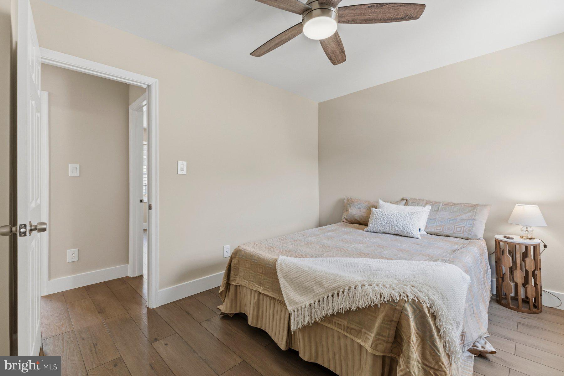 6028 Sweet Dale Court Springfield, VA 22152 - Photo 16 of 29 a bedroom with a bed and a chandelier