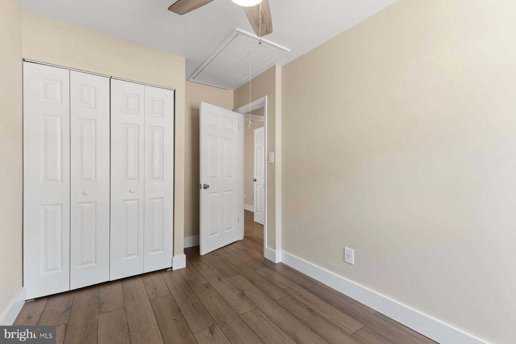 6028 Sweet Dale Court Springfield, VA 22152 - Photo 20 of 29 a view of an empty room with wooden floor