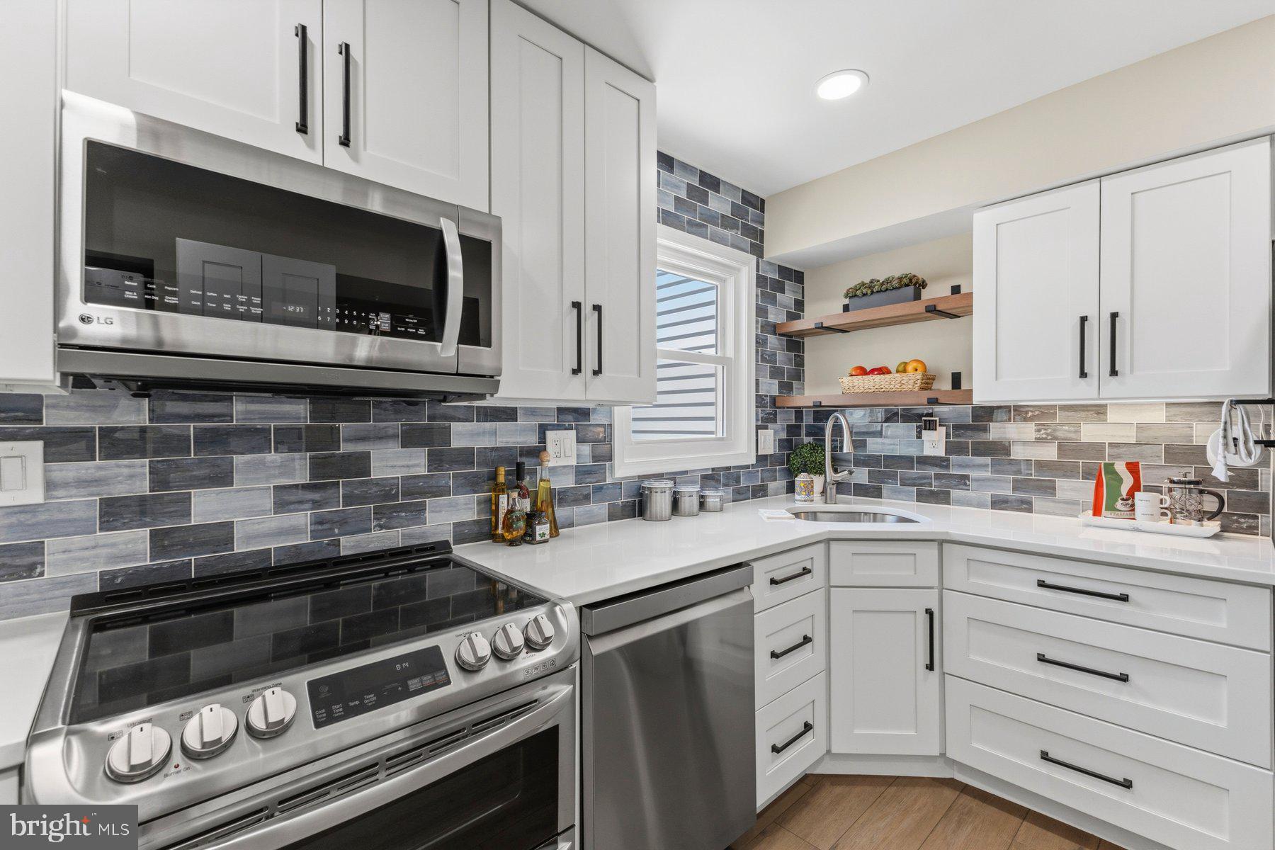 6028 Sweet Dale Court Springfield, VA 22152 - Photo 9 of 29 a kitchen with cabinets stainless steel appliances and a sink