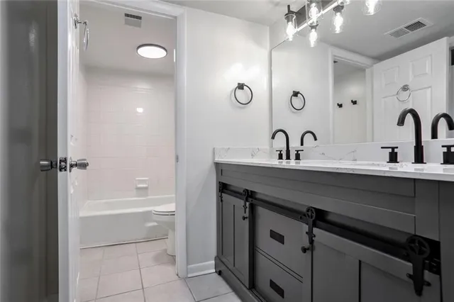 a white bath tub sitting next to a white toilet