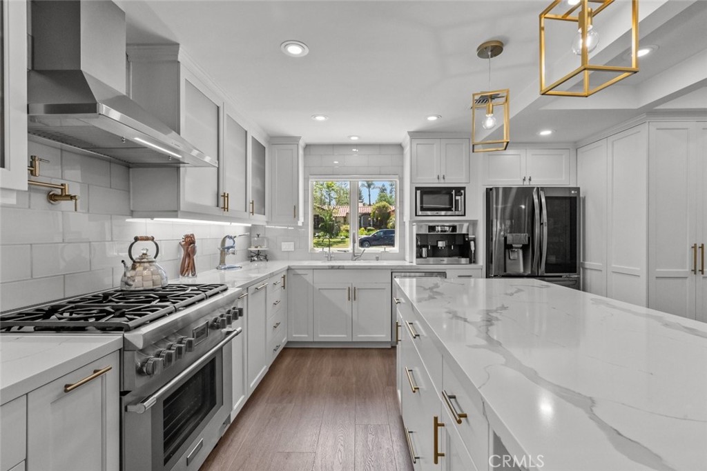 2534 Page Drive Altadena, CA 91001 - Photo 16 of 48 a large kitchen with stainless steel appliances granite countertop a stove and a sink