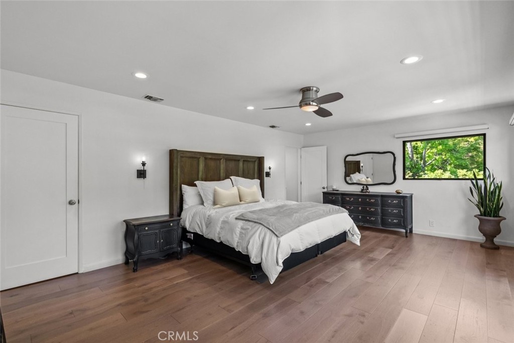 2534 Page Drive Altadena, CA 91001 - Photo 36 of 48 a spacious bedroom with a bed and a flat screen tv