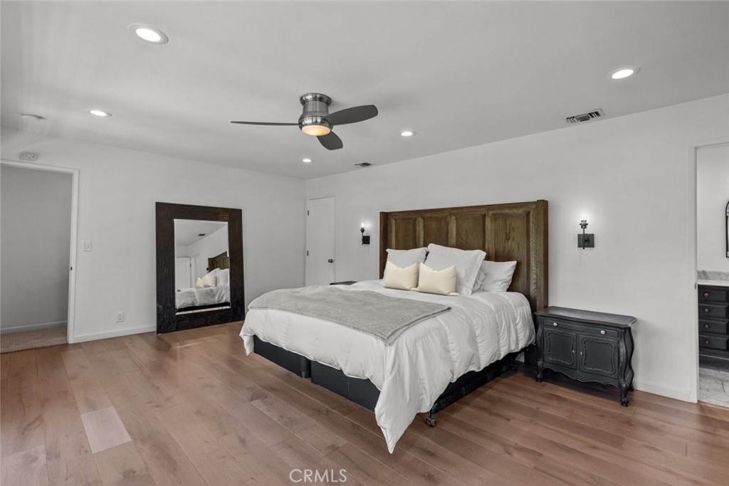 2534 Page Drive Altadena, CA 91001 - Photo 37 of 48 a bedroom with a bed and a ceiling fan