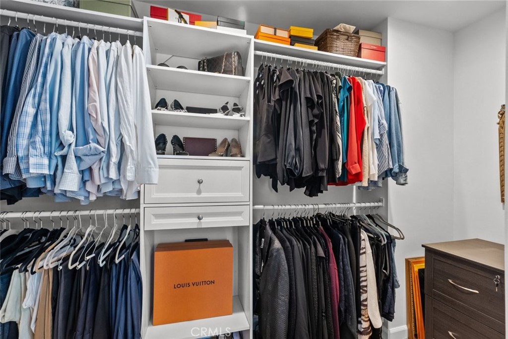 2534 Page Drive Altadena, CA 91001 - Photo 38 of 48 a view of walk in closet with clothes and shoes