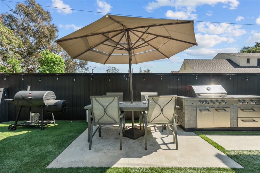2534 Page Drive Altadena, CA 91001 - Photo 46 of 48 a view of a patio with a table and chairs under an umbrella
