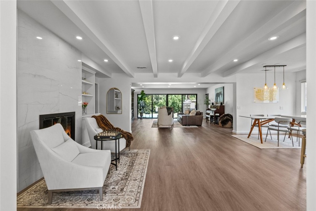 2534 Page Drive Altadena, CA 91001 - Photo 8 of 48 a living room with fireplace furniture and a wooden floor