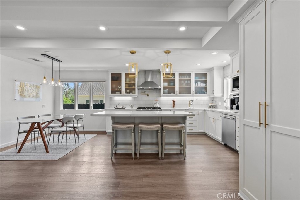 2534 Page Drive Altadena, CA 91001 - Photo 10 of 48 a kitchen with a table chairs stove and wooden floor