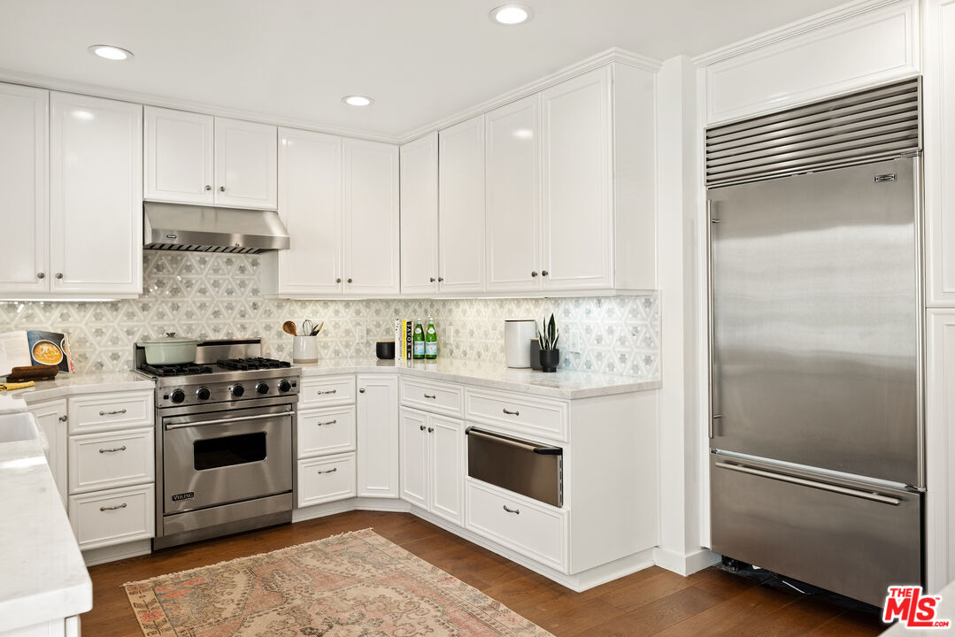 1314 Preston Way Venice, CA 90291 - Photo 14 of 37 a kitchen with white cabinets and white stainless steel appliances
