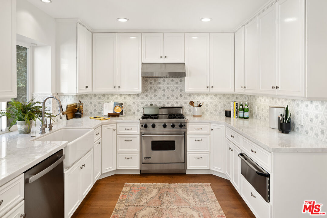 1314 Preston Way Venice, CA 90291 - Photo 15 of 37 a white kitchen with granite countertop stainless steel appliances