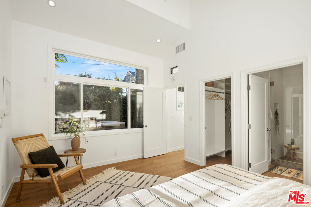 1314 Preston Way Venice, CA 90291 - Photo 24 of 37 a bedroom with a bed and wooden floor