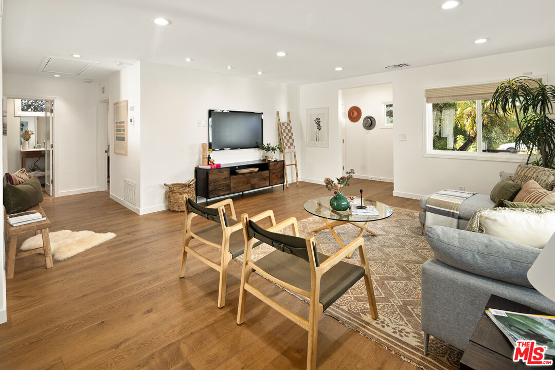 1314 Preston Way Venice, CA 90291 - Photo 4 of 37 a living room with furniture a flat screen tv and a large window