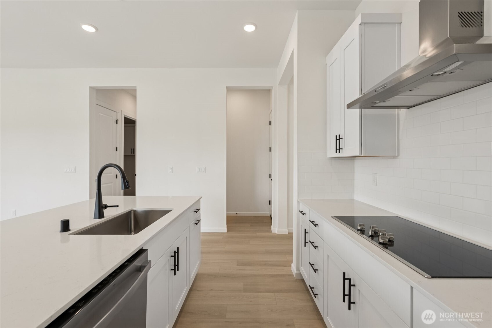 4142 Southwest Muller Lane, Unit 310 Port Orchard, WA 98367 - Photo 11 of 14 a kitchen with stainless steel appliances a sink stove and cabinets