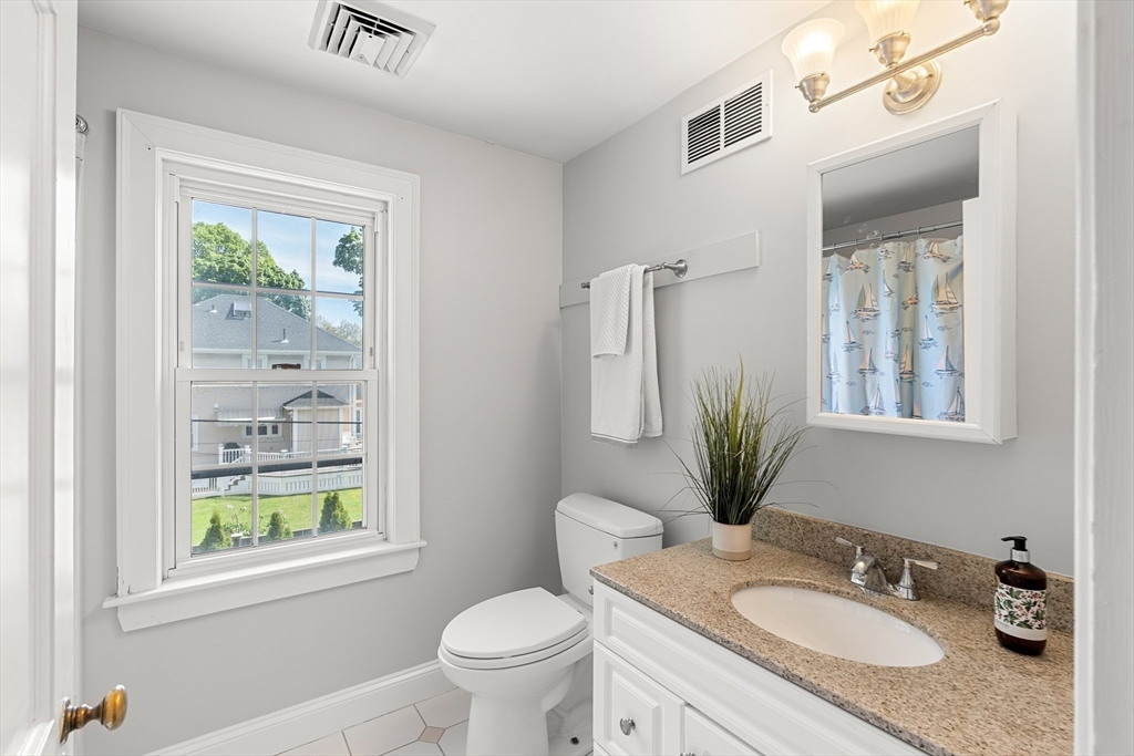 6 Shetland Road Marblehead, MA 01945 - Photo 27 of 39 a bathroom with a granite countertop sink toilet and mirror