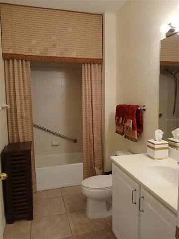 a room with wooden floor and windows