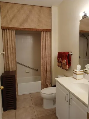 a room with wooden floor and windows