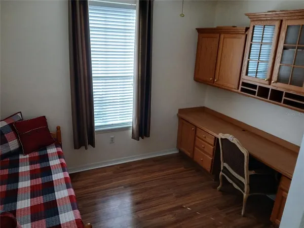a view of cabinets and wooden floor