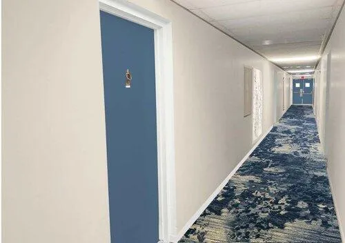 a view of a garden with a fountain in the background