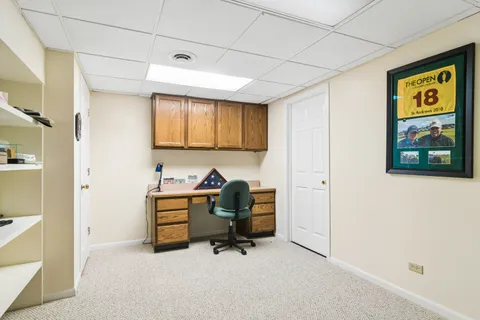 a view of a workspace with furniture