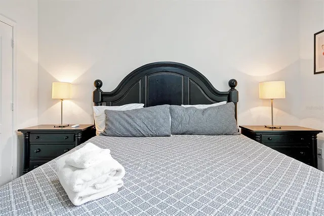 a bedroom with bed and a dresser