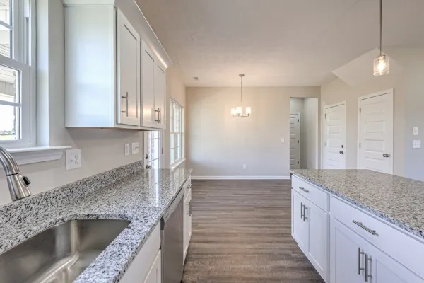 a kitchen with stainless steel appliances granite countertop a sink and a granite counter tops
