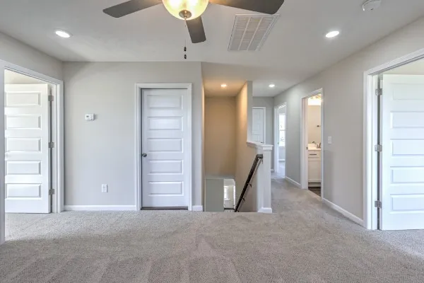 a view of a hallway with staircase