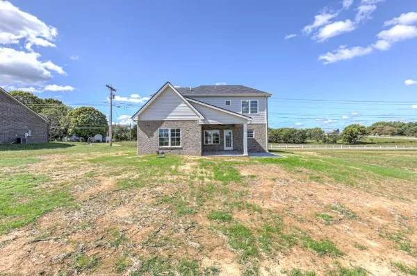a view of a house with a big yard
