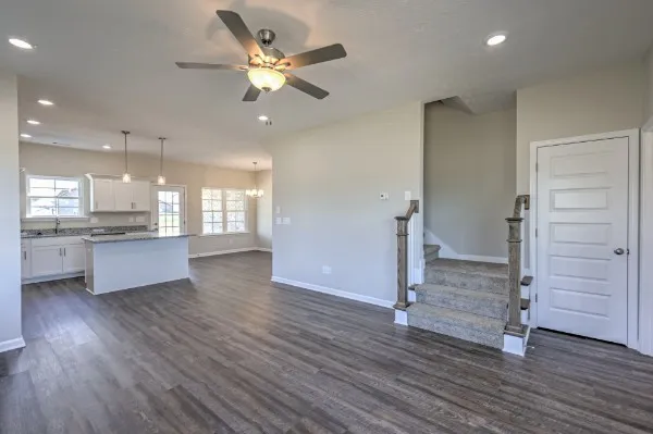 a view of a kitchen with wooden floor and a kitchen