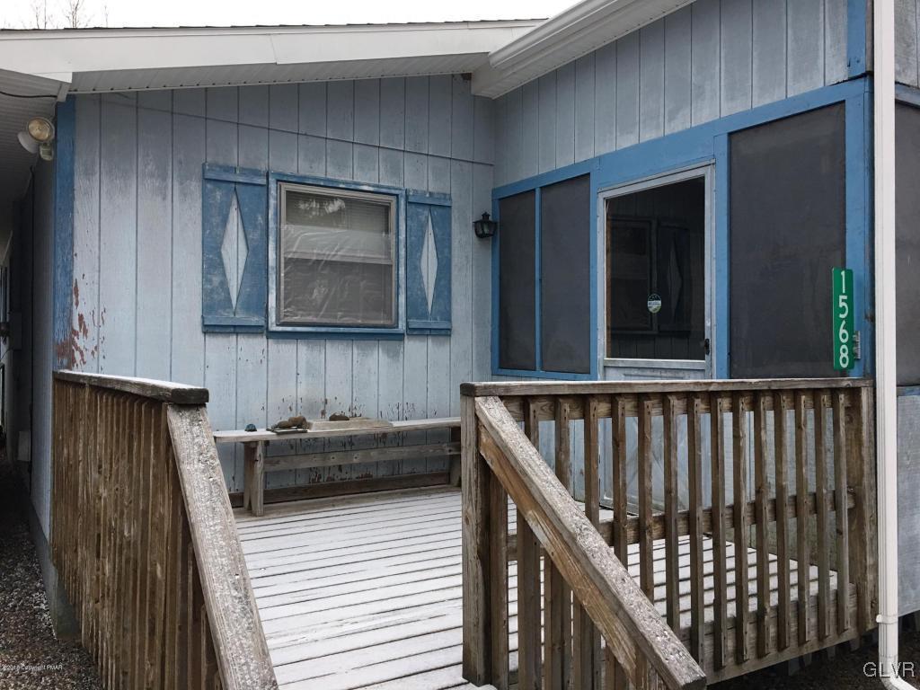 1568 Clover Road Long Pond, PA 18334 - Photo 4 of 14 a view of a balcony with furniture and wooden floor