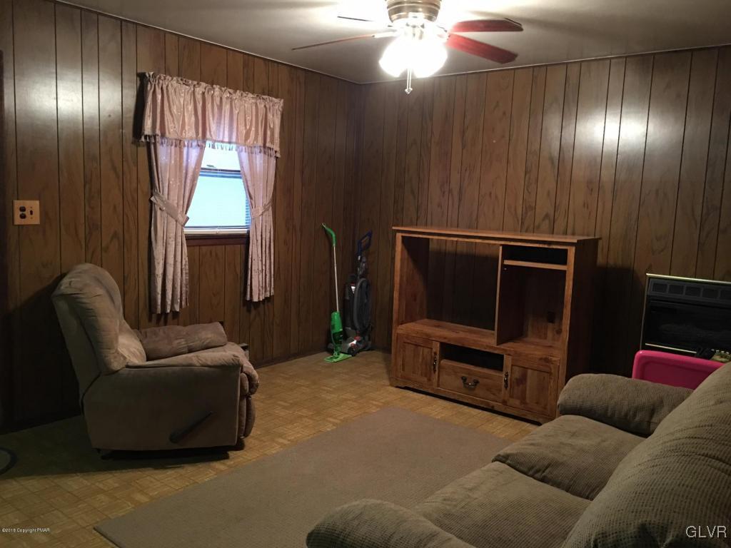 1568 Clover Road Long Pond, PA 18334 - Photo 6 of 14 a living room with furniture and a window