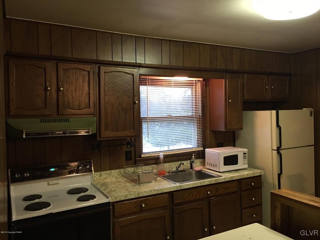1568 Clover Road Long Pond, PA 18334 - Photo 7 of 14 a kitchen with a sink a refrigerator and window