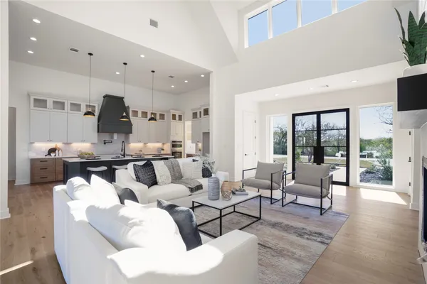 a bathroom with a double vanity sink toilet and shower