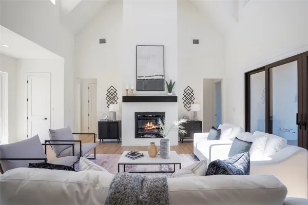 a kitchen with a sink a stove and chairs