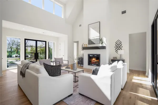a bathroom with a toilet sink vanity and mirror