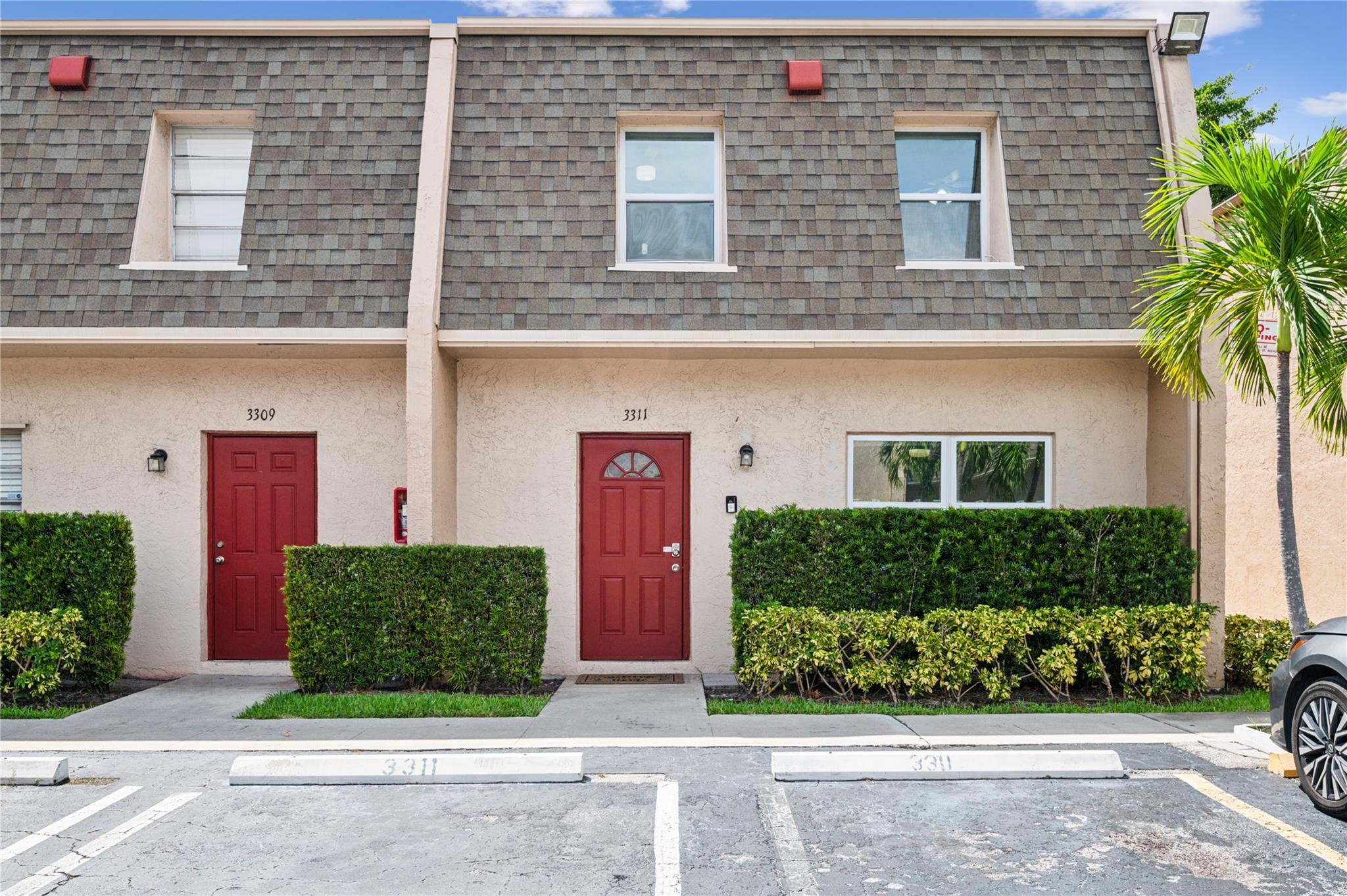 a front view of a house with a yard