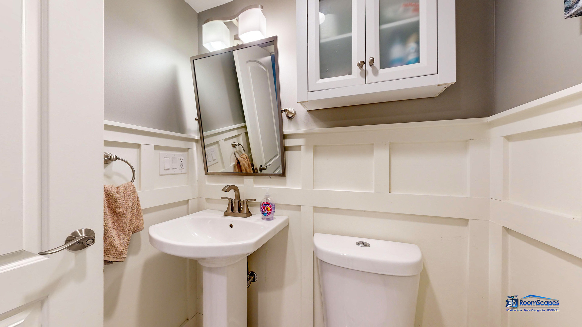 35142 North Lk Shr Road Ingleside, IL 60041 - Photo 40 of 60 a bathroom with a sink a mirror and a toilet