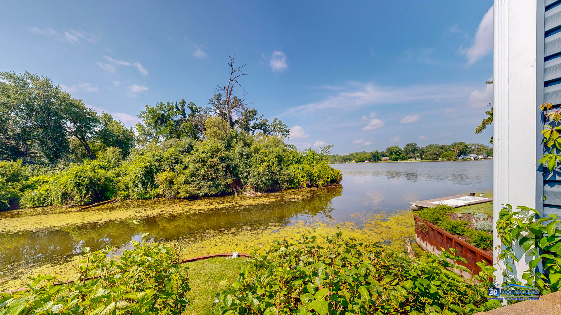 35142 North Lk Shr Road Ingleside, IL 60041 - Photo 48 of 60 a view of a lake with a house in the background