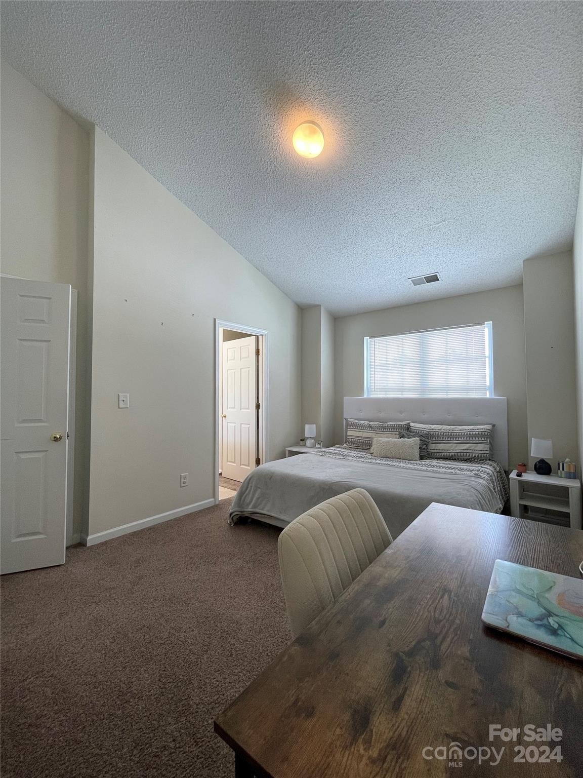 3216 Barons Court Road Charlotte, NC 28213 - Photo 23 of 29 a spacious bedroom with two beds and a couch