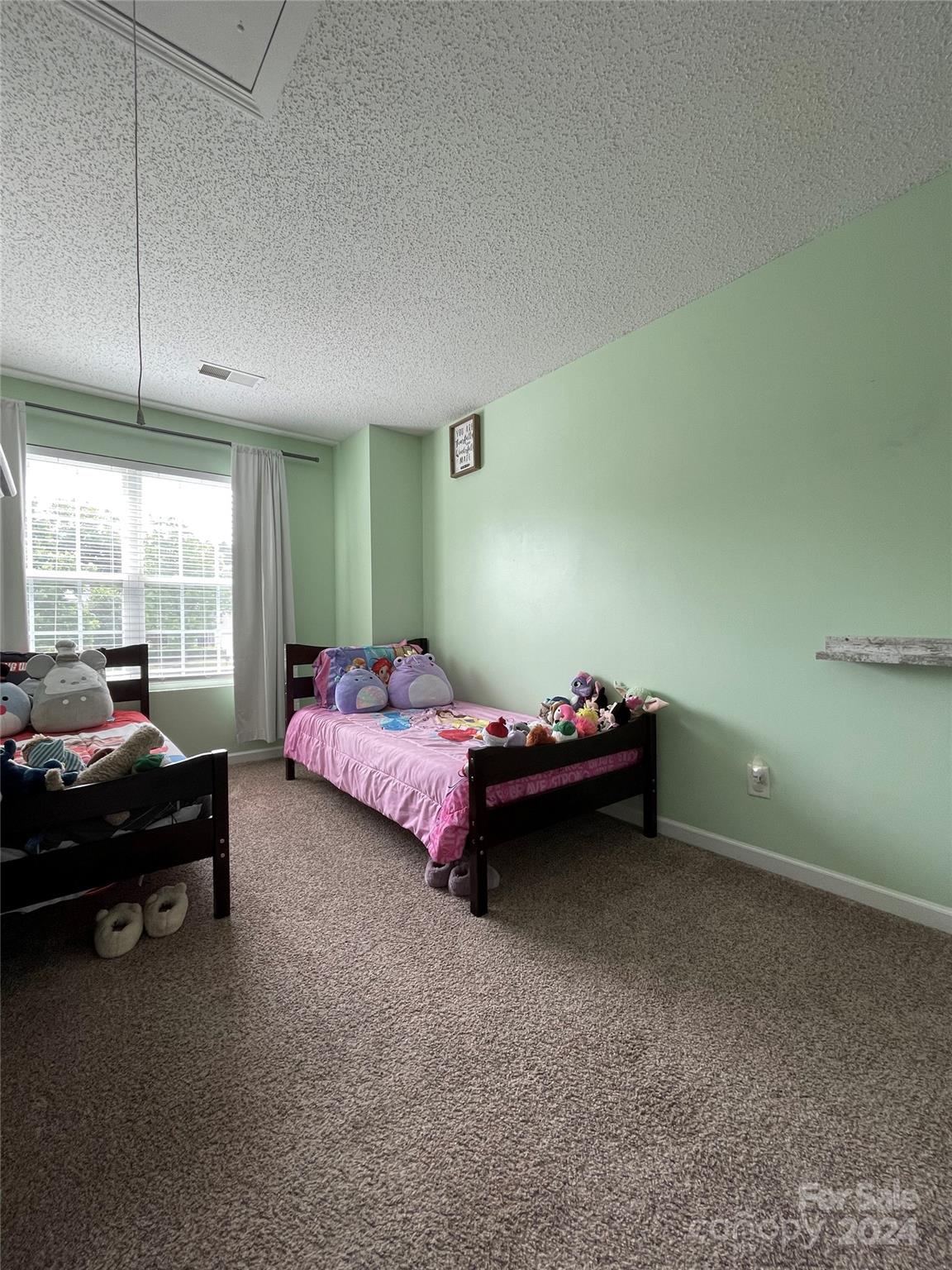 3216 Barons Court Road Charlotte, NC 28213 - Photo 27 of 29 a bedroom with bed and window
