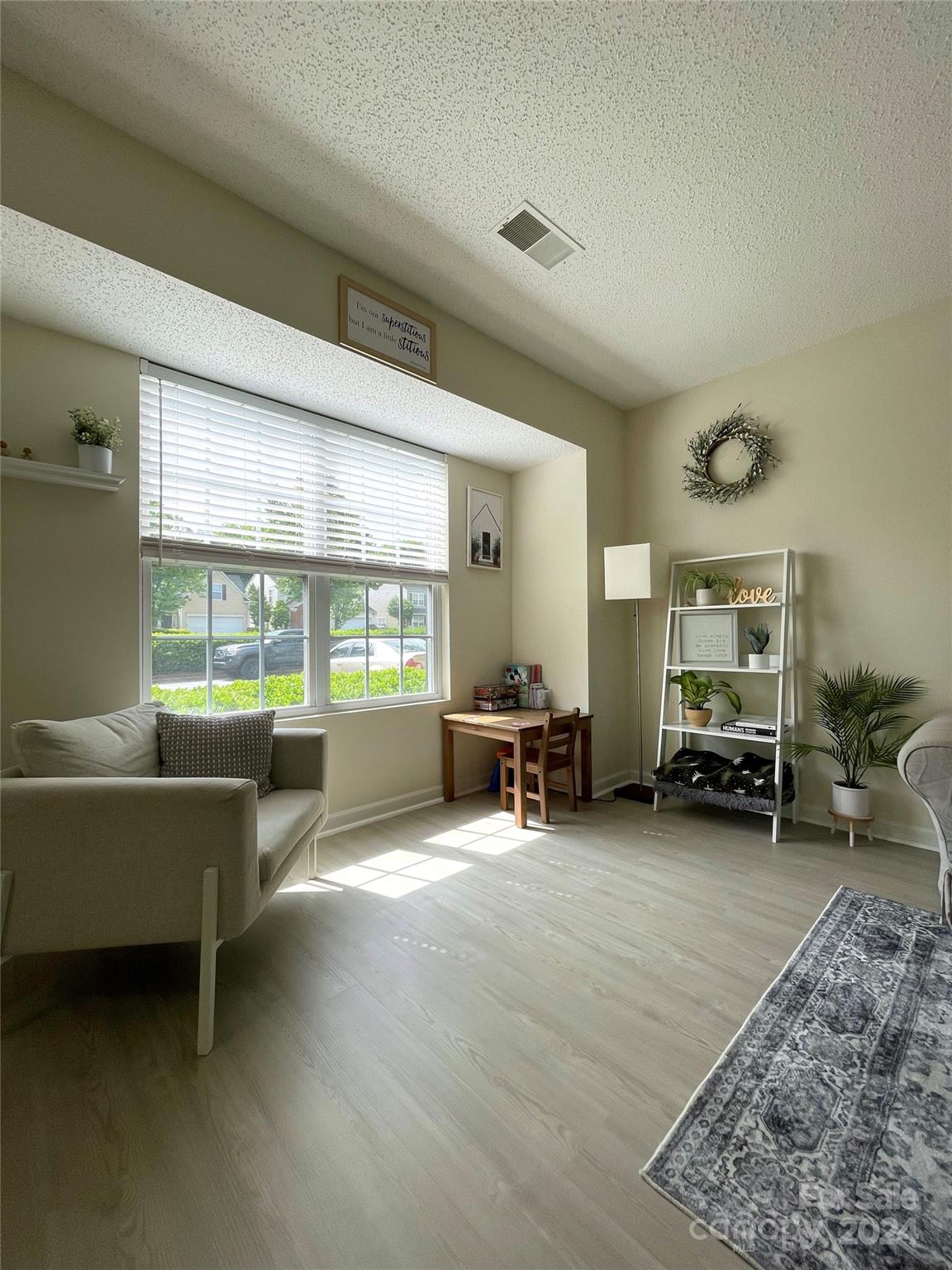3216 Barons Court Road Charlotte, NC 28213 - Photo 6 of 29 a living room with furniture and a large window