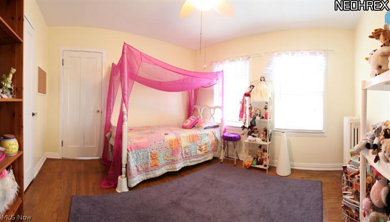 3273 Chadbourne Road Cleveland, OH 44120 - Photo 13 of 25 Bedroom 2 located on the Second Floor. Wood floors, window blinds, ceiling fan w/light fixture.